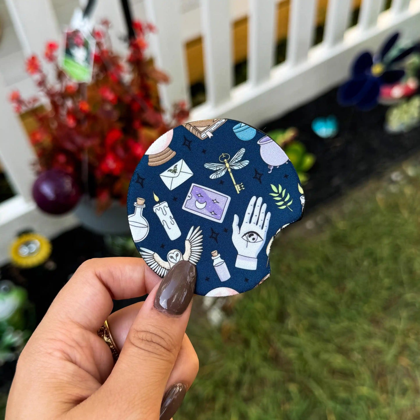 a dark blue car coaster with a mystical design inspired by harry potter and the wizarding world