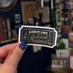  A transparent bookish sticker in shape of an admission ticket with the words "admit one dark academia" for a booktok book club.