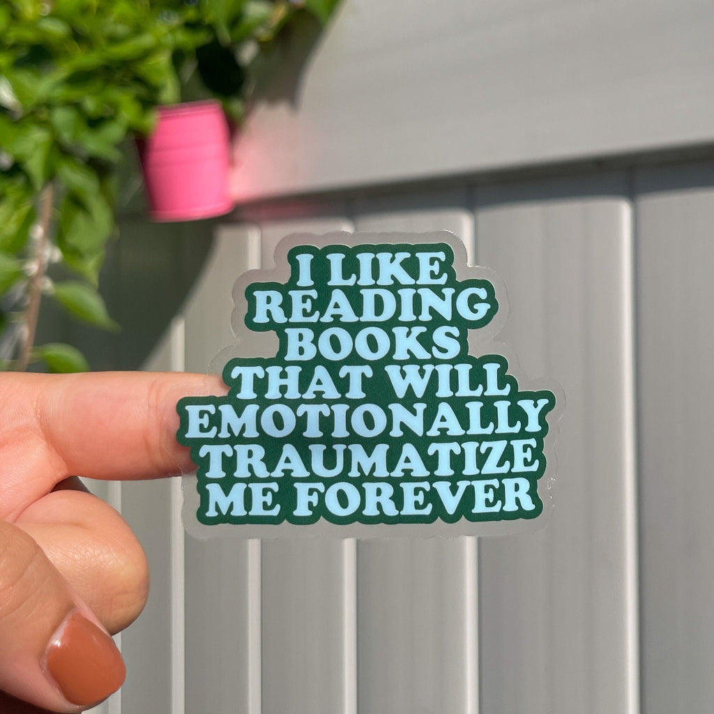 Transparent bookish sticker with the quote "i like reading books that will emotionally traumatize me forever". 