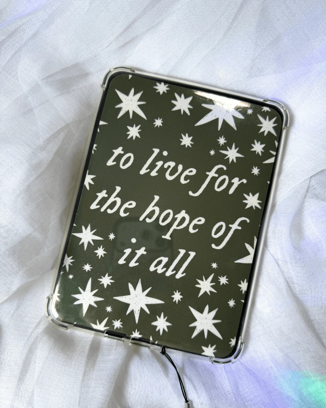 A green kindle insert with the quote "to live for the hope of it all" surrounded by stars.