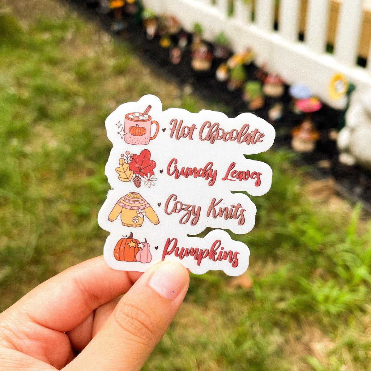 Fall checklist sticker featuring hot chocolate, crunchy leaves, cozy knits, and pumpkins.