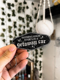 black, sparkly motel keychain with the lyrics "nothing good starts in a getaway car" inspired by taylor swift's album reputation. 