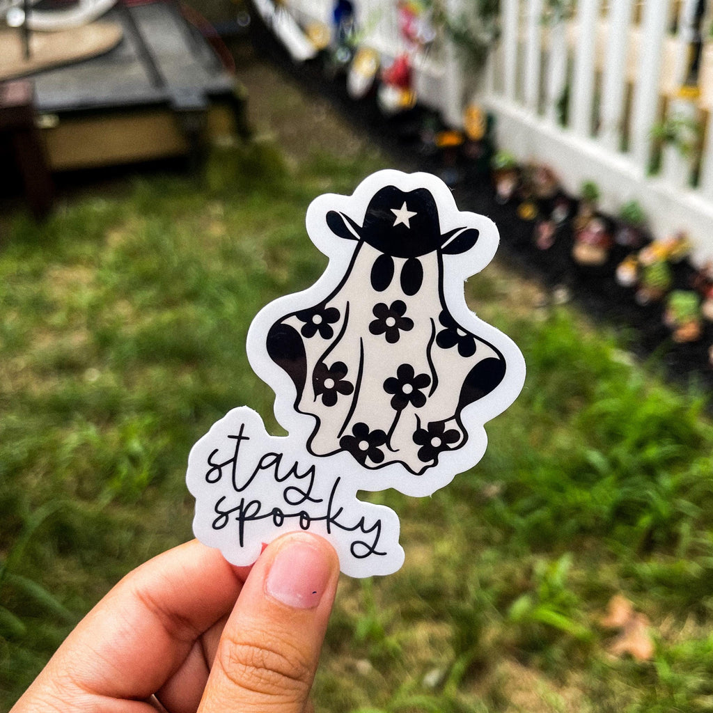 Ghost with a cowboy hat and flowers on it with the text 'stay spooky'