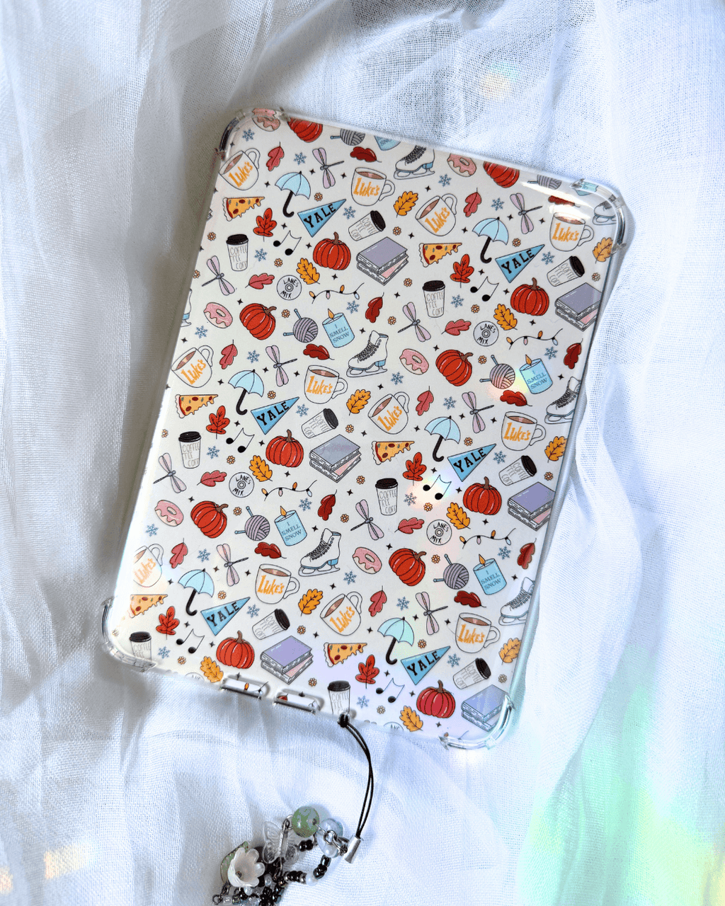 kindle insert with a patterned collage of random illustrations inspired by gilmore girls.