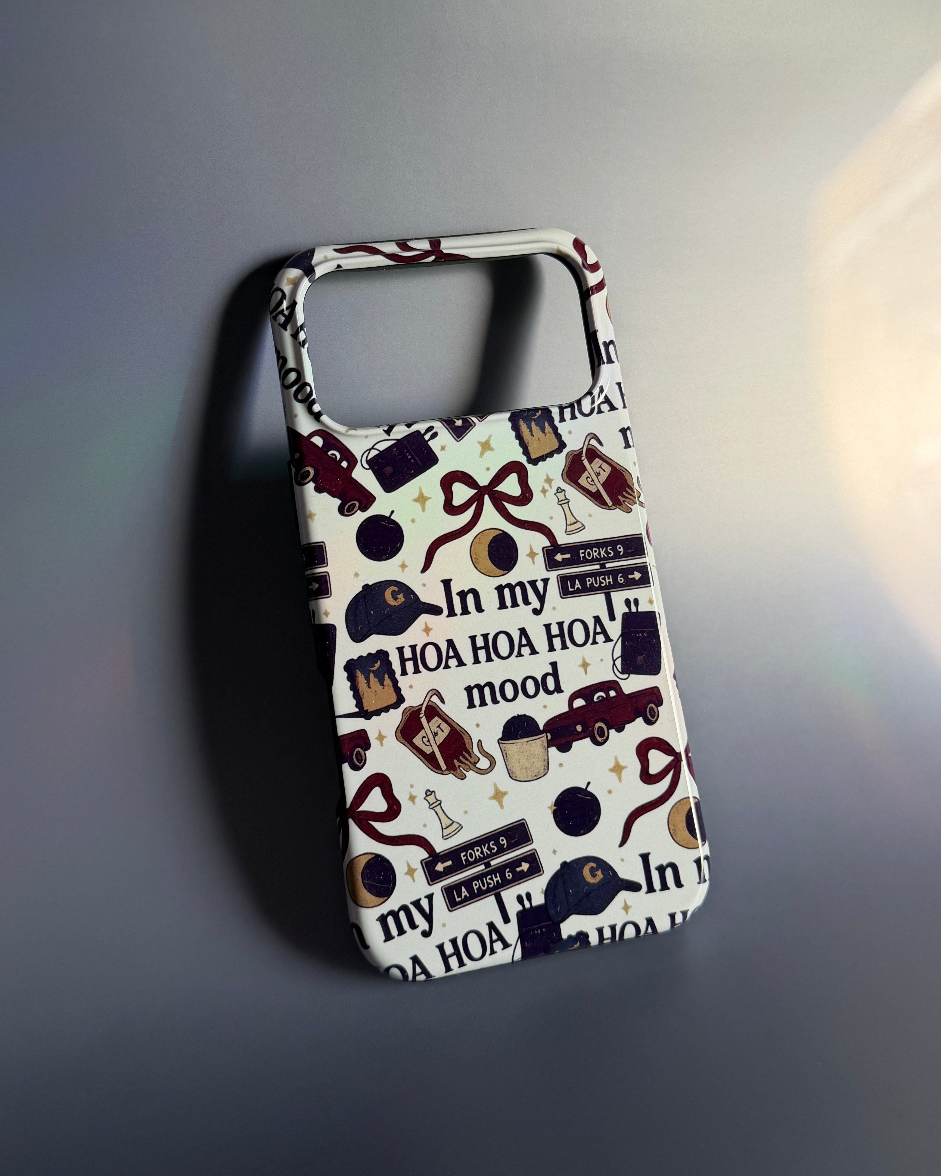 A phone case featuring a collage of various Twilight-inspired designs, with the text "In my hoa hoa hoa mood?"