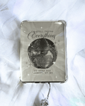 Grayish kindle insert with a large mirrorball and the quote "i'm still trying everything to keep you looking at me."