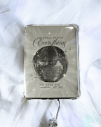 Grayish kindle insert with a large mirrorball and the quote "i'm still trying everything to keep you looking at me."