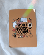 Kindle insert featuring a cute Halloween-themed graphic that reads 'tis the season for spooky books & cookies' surrounded by illustrations of a ghost, leaves, cookies, etc.