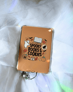 Kindle insert featuring a cute Halloween-themed graphic that reads 'tis the season for spooky books & cookies' surrounded by illustrations of a ghost, leaves, cookies, etc.