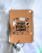 Kindle insert featuring a cute Halloween-themed graphic that reads 'tis the season for spooky books & cookies' surrounded by illustrations of a ghost, leaves, cookies, etc.