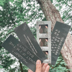 A collection of four bookmarks with Twilight-related quotes and imagery, held in a hand against a natural background.