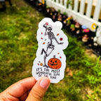 A sticker with a skeleton character, pumpkin, and autumn leaves with the text 'It's the most wonderful time of the year'.